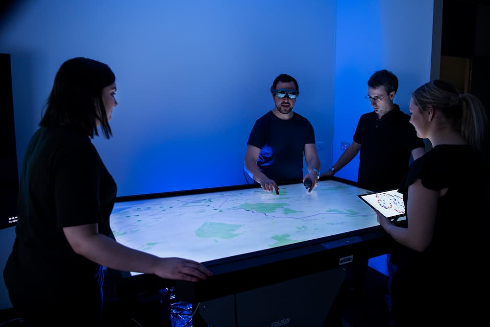 Researchers exploring data on a table computer